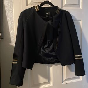 Blue jacket with gold and it fit more like a XS to S